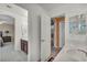 Bright bathroom with white countertops and view of the main bedroom at 9504 Empire Rock St, Las Vegas, NV 89143