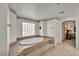 Bathroom with a soaking tub that offers a relaxing retreat and a glass block window at 9504 Empire Rock St, Las Vegas, NV 89143