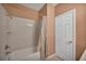 Clean bathroom with a tub and shower combination, perfect for relaxation at 9504 Empire Rock St, Las Vegas, NV 89143