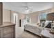 Comfortable bedroom with natural light and neutral tones, creating a serene atmosphere at 9504 Empire Rock St, Las Vegas, NV 89143