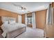 Inviting bedroom with plush carpeting, ceiling fan, and ample natural light at 9504 Empire Rock St, Las Vegas, NV 89143