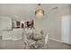 Breakfast nook featuring glass table, elegant chandelier and kitchen access, creating a cozy atmosphere for meals at 9504 Empire Rock St, Las Vegas, NV 89143