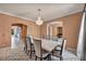 Elegant dining room with arched entryways and chandelier at 9504 Empire Rock St, Las Vegas, NV 89143