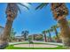Beautifully landscaped front yard with mature palm trees at 9504 Empire Rock St, Las Vegas, NV 89143
