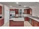 Spacious kitchen featuring stainless steel appliances and a large island at 9504 Empire Rock St, Las Vegas, NV 89143