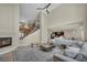 Bright, open living area with fireplace, high ceilings, and contemporary decor at 9504 Empire Rock St, Las Vegas, NV 89143