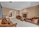 Elegant living room with plush seating and cozy fireplace, perfect for relaxing at 9504 Empire Rock St, Las Vegas, NV 89143