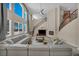 Spacious living room with high ceilings, a fireplace, and abundant natural light at 9504 Empire Rock St, Las Vegas, NV 89143