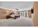 Expansive main bedroom with ceiling fan and private balcony access at 9504 Empire Rock St, Las Vegas, NV 89143