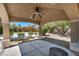 Covered patio with a ceiling fan and a view of the backyard is perfect for outdoor relaxation at 9504 Empire Rock St, Las Vegas, NV 89143