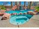 Inviting backyard pool and hot tub area for relaxation and entertainment at 9504 Empire Rock St, Las Vegas, NV 89143