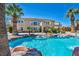 Backyard view of pool and house showing two-story house with balcony at 9504 Empire Rock St, Las Vegas, NV 89143