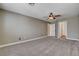 Neutral bedroom with soft carpet and a ceiling fan for added comfort at 9655 Lame Horse Dr, Las Vegas, NV 89123