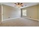This bedroom provides natural light, carpet and ceiling fan at 9655 Lame Horse Dr, Las Vegas, NV 89123