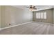 This bedroom offers a window and neutral carpet at 9655 Lame Horse Dr, Las Vegas, NV 89123