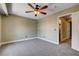 Bedroom featuring soft carpet, a ceiling fan, and access to an en-suite bathroom at 9655 Lame Horse Dr, Las Vegas, NV 89123