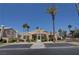 Exterior of community clubhouse with manicured landscaping, palms and ample parking at 9655 Lame Horse Dr, Las Vegas, NV 89123