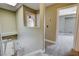 Hallway with two rooms and stairs that lead downstairs at 9655 Lame Horse Dr, Las Vegas, NV 89123