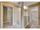 Neutral hallway features carpet flooring, skylight, and doorway into the bedroom at 9655 Lame Horse Dr, Las Vegas, NV 89123