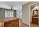 Open kitchen featuring tile countertops and views into the living room at 9655 Lame Horse Dr, Las Vegas, NV 89123