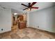 Eat-in kitchen with tile flooring, wood cabinets, and stainless-steel appliances at 9655 Lame Horse Dr, Las Vegas, NV 89123