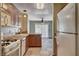 Open kitchen featuring tile countertops and views into the living room at 9655 Lame Horse Dr, Las Vegas, NV 89123