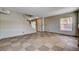 Spacious living room with tile flooring, staircase, and bright natural light at 9655 Lame Horse Dr, Las Vegas, NV 89123
