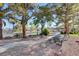 Community park featuring picnic tables, BBQ grills, and mature trees providing shade at 9655 Lame Horse Dr, Las Vegas, NV 89123