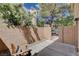 Enclosed patio with brick walls and a gate, offering privacy and outdoor space at 9655 Lame Horse Dr, Las Vegas, NV 89123