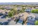 A beautiful shot of the neighborhood, showcasing the well-kept yards and the sense of community at 9831 Running Rabbit St, Las Vegas, NV 89143