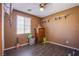 Versatile room with laminate flooring, offering endless possibilities for a bedroom or creative space at 9831 Running Rabbit St, Las Vegas, NV 89143