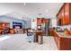 Open kitchen featuring stainless steel appliances, granite countertops, and a central island with bar seating at 9831 Running Rabbit St, Las Vegas, NV 89143