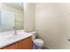 Bathroom features a modern sink and faucet combination, along with a toilet and towel bar at 10457 Armand Ave, Las Vegas, NV 89129