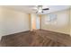 Bright bedroom features carpeted flooring, neutral walls, ceiling fan, and ample natural light at 10457 Armand Ave, Las Vegas, NV 89129