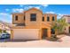 Two-story home featuring a two car garage, neutral stucco, and a red tile roof at 10457 Armand Ave, Las Vegas, NV 89129