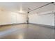 Spacious garage with epoxy flooring, bright lighting and room for parking and storage at 10457 Armand Ave, Las Vegas, NV 89129