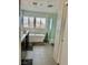 Bright bathroom with a soaking tub, shower, and mountain views at 10650 Robin Hill Ave, Las Vegas, NV 89129