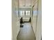 Modern bathroom with stylish tub, tiled floors, and dual sinks at 10650 Robin Hill Ave, Las Vegas, NV 89129