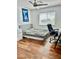 Bedroom with modern furniture, hardwood flooring, and ample natural light at 10650 Robin Hill Ave, Las Vegas, NV 89129