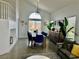 Spacious dining room with high ceilings, natural light, and stylish decor at 10650 Robin Hill Ave, Las Vegas, NV 89129