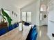 Bright living room and dining area with modern decor and large windows, offering ample natural light at 10650 Robin Hill Ave, Las Vegas, NV 89129