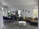 Bright living room with comfortable seating, dining table with chairs, and modern decor at 10650 Robin Hill Ave, Las Vegas, NV 89129