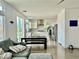 Bright, open floor plan with modern kitchen and spacious living area with natural light at 10650 Robin Hill Ave, Las Vegas, NV 89129