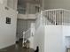 Grand staircase with white railings leading to the upper level of the home at 10650 Robin Hill Ave, Las Vegas, NV 89129