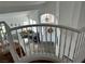 Elegant staircase featuring white railings, leading to the bright and airy living space at 10650 Robin Hill Ave, Las Vegas, NV 89129