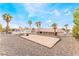 Spacious backyard features gravel, mature trees and a bocce ball court at 1108 Sidehill Way, Las Vegas, NV 89110