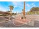 Expansive backyard featuring desert landscaping and an inviting covered patio at 1108 Sidehill Way, Las Vegas, NV 89110