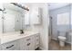 Well-lit bathroom with white vanity and updated fixtures, toilet and shower in separate alcove at 1108 Sidehill Way, Las Vegas, NV 89110