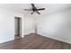 A bright, spacious bedroom featuring modern flooring and ceiling fan at 1108 Sidehill Way, Las Vegas, NV 89110