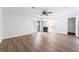 Primary bedroom boasts wood-look floors, a ceiling fan, fireplace, and sliding door to the backyard at 1108 Sidehill Way, Las Vegas, NV 89110